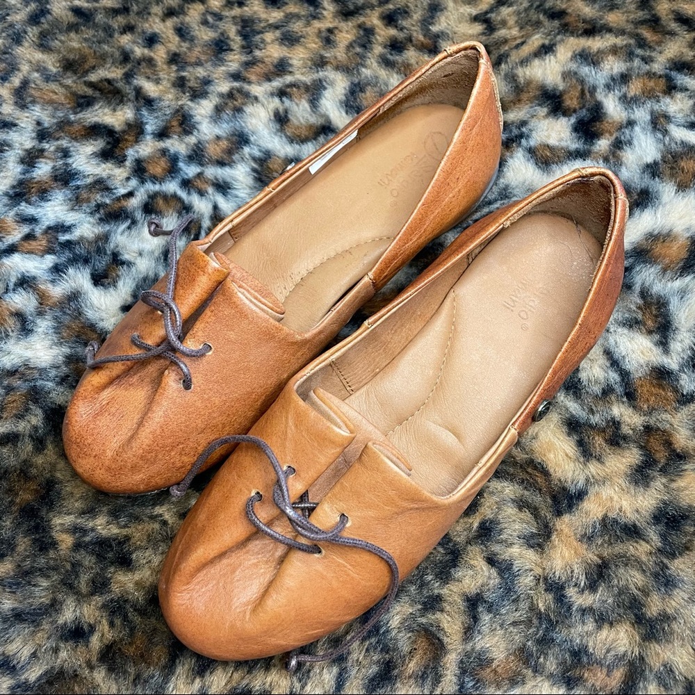 Brown slip on flat shoes by Sergio Tomani